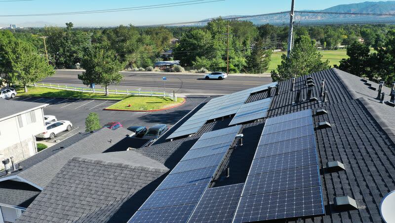 Solar panels are pictured installed on an apartment complex in Cottonwood Heights on Wednesday, July 12, 2023.