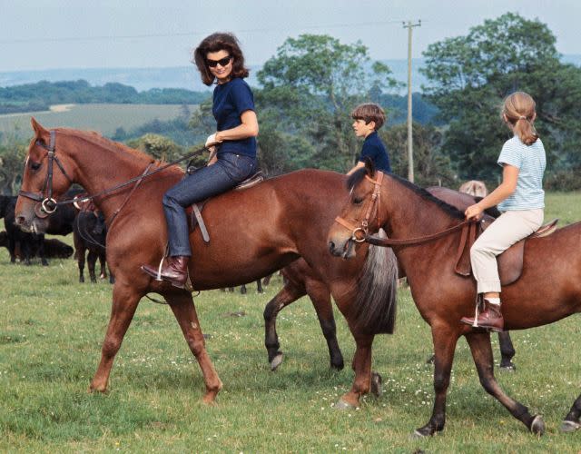 (Original Caption) Mrs. John F. Kennedy, accompanied by her children, Caroline and John Jr., appear at press conference here June 16th on horseback. They are in Ireland on a six-week holiday.