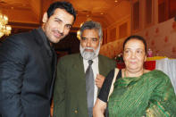 John Abraham with his parents.