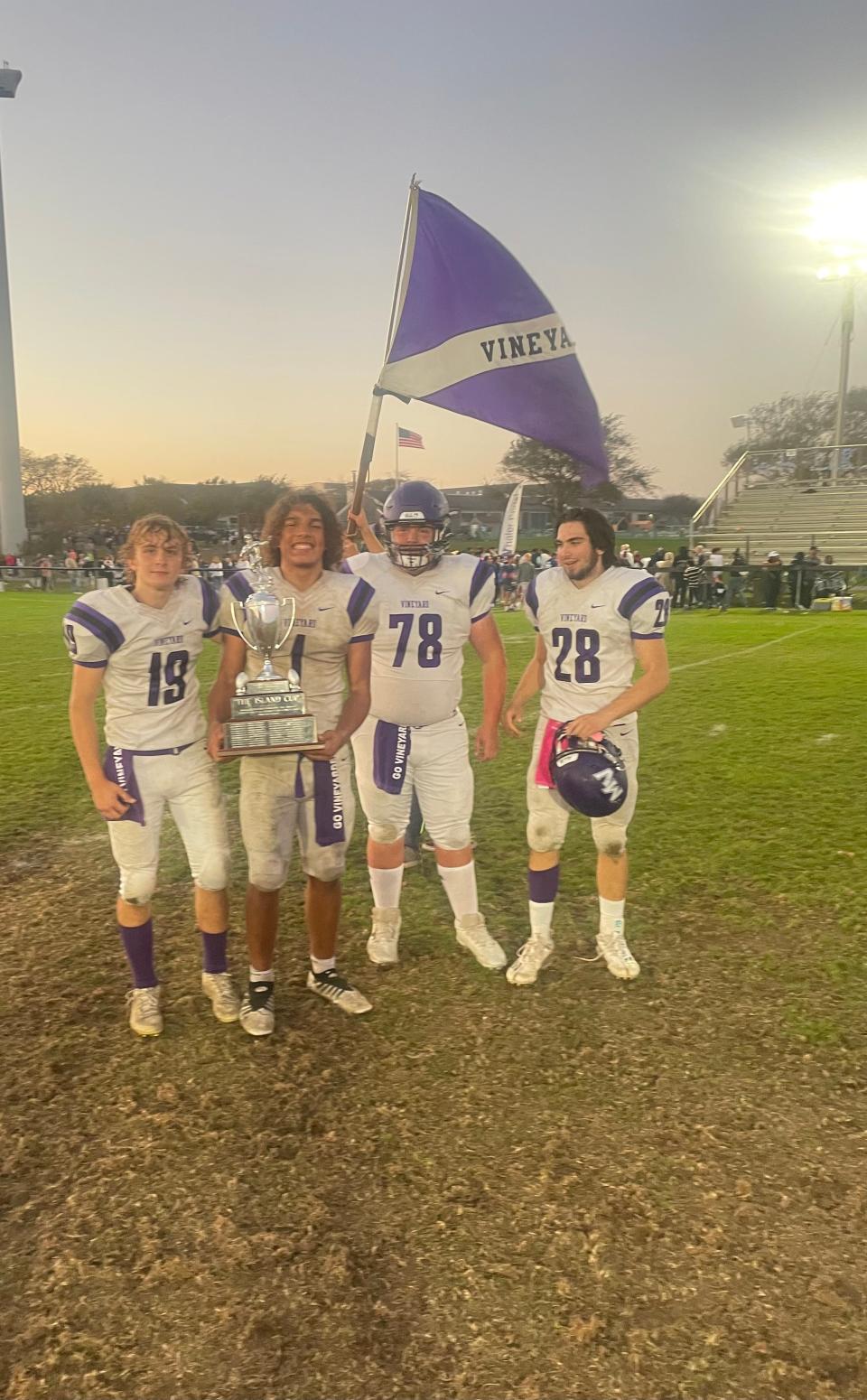 Aiden Conley, left to right, Guilherme Oliveira, Brody Royal, and Gerry Kane of Martha's Vineyard pose with the Island Cup Trophy.