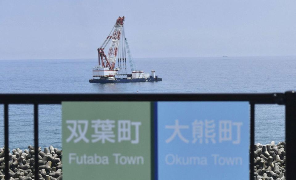 PHOTO:A crane ship is seen near the discharge outlet meant to release Advanced Liquid Processing System treated water into the sea off the tsunami-crippled Fukushima Daiichi nuclear power plant in Okuma town, Fukushima prefecture, Japan August 22, 2023. (Kyodo via Reuters)