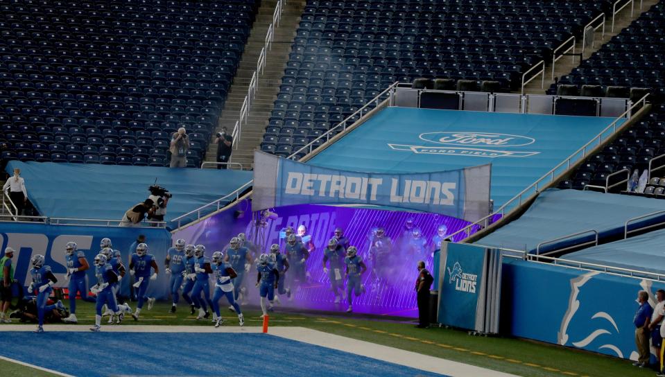 The Lions take the field before the first half at Ford Field on Sunday, Sept. 13, 2020.