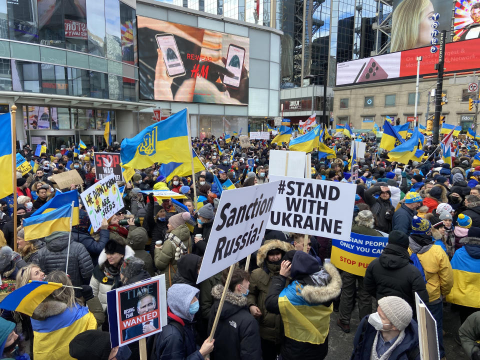 Thousands of people marched in downtown Toronto against Russian invasion of Ukrine on Sunday February 27, 2022. People carrying Ukraine flags and anti-Vladimir Putin signs gathered at Yonge and Dundas Square, and marched towards Nathan Phillips Square in solidarity with the people of Ukraine.  (Photo by Sayed Najafizada/NurPhoto via Getty Images)