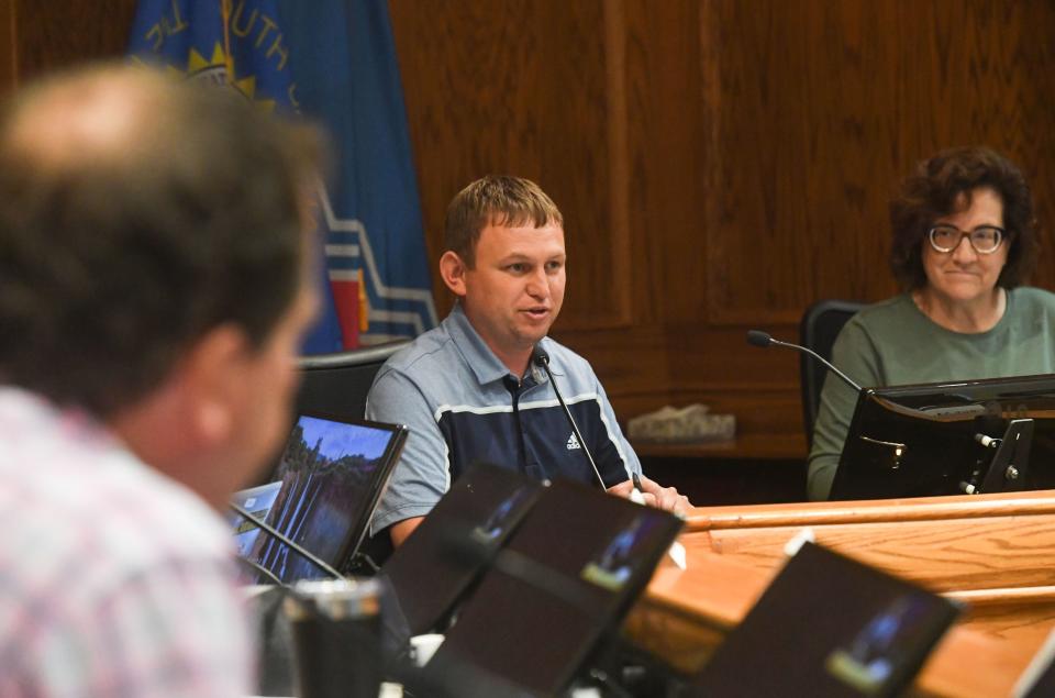 Rich Merkouris, chair of the city's newly established homeless task force, welcomes attendees to a public input session on Monday, August 8, 2022, at Carnegie Town Hall in Sioux Falls.