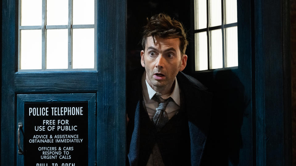 David Tennant poking his head out of the TARDIS door.
