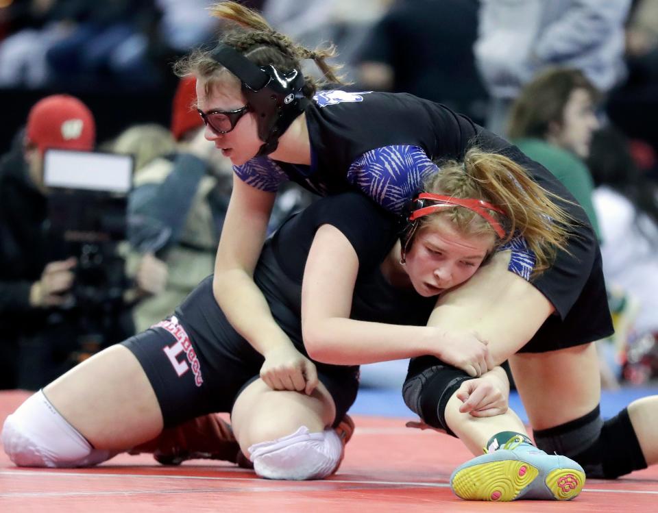 New London's Hailie Krueger, left, wrestles against Milwaukee Ronald Reagan's Natalie Maceau in a girls 145-pound semifinal match during the WIAA individual state wrestling tournament Feb. 24 in Madison.