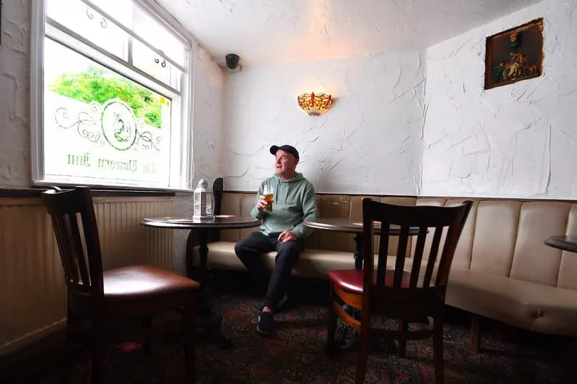 A regular enjoying a pint at the Unicorn Inn, Cronton