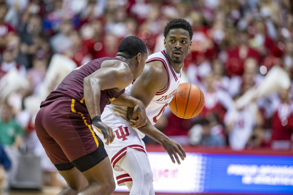 Indiana guard Xavier Johnson brings the ball up the court while being defended by Bethune-Cookman guard Marcus Garrett during the second half of an NCAA college basketball game, Thursday, Nov. 10, 2022, in Bloomington, Ind. (AP Photo/Doug McSchooler)