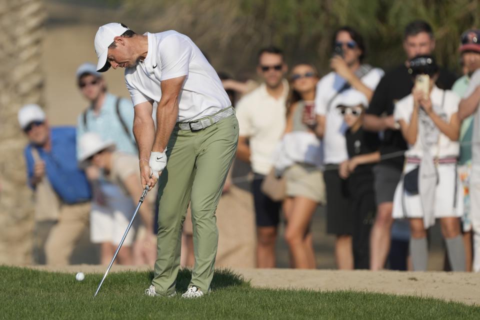 Rory McIlroy of Northern Ireland plays his second shot on 14th hole during the final round of the Hero Dubai Desert Classic golf tournament, in Dubai, United Arab Emirates, Sunday, Jan. 21, 2024. (AP Photo/Kamran Jebreili)