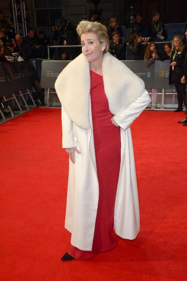 British actress Emma Thompson poses for photographers on the red carpet at the EE British Academy Film Awards held at the Royal Opera House on Sunday Feb. 16, 2014, in London. (photos by Jon Furniss/Invision/AP)