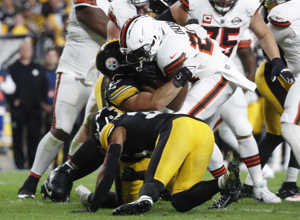 Sep 18, 2023; Pittsburgh, Pennsylvania, USA; Cleveland Browns running back Nick Chubb (24) is tackled by Pittsburgh Steelers linebacker Cole Holcomb (55) and safety Minkah Fitzpatrick (39) during the second quarter against at Acrisure Stadium. Chubb was injured on the play and taken from the field on a cart. Mandatory Credit: Charles LeClaire-USA TODAY Sports