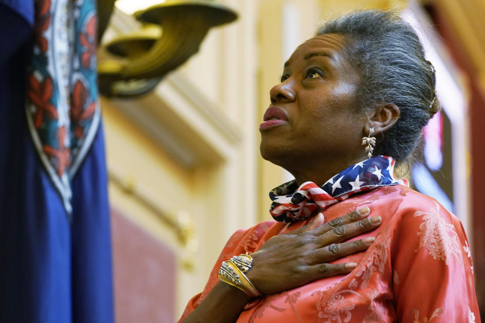 Virginia Lt. Gov. Winsome Earle-Sears pledges allegiance as she presides at the Capitol Monday Jan. 17, 2022, in Richmond, Va. (AP Photo/Steve Helber)