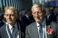 Alitalia President Luca cordero di Montezemolo, left, and former Italian soccer player and coach Marcello Lippi, right, arrive during the first day of the 134th Session of the International Olympic Committee (IOC), at the SwissTech Convention Centre, in Lausanne, Switzerland, Monday, June 24, 2019. The host city of the 2026 Olympic Winter Games will be decided during the134th IOC Session. Stockholm-Are in Sweden and Milan-Cortina in Italy are the two candidate cities for the Olympic Winter Games 2026. (Jean-Christophe Bott/Keystone via AP)