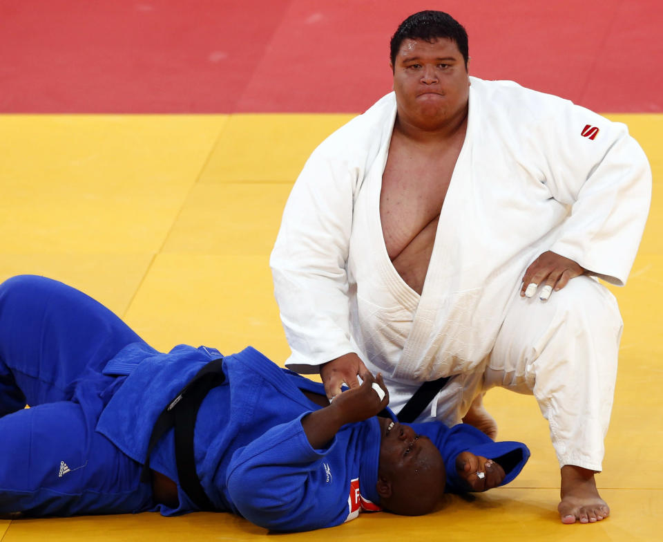 Guam's Ricardo Blas Jr. looks up after winning his men's  100kg elimination round of 32 judo match against Guinea's Facinet Keita at the London 2012 Olympic Games