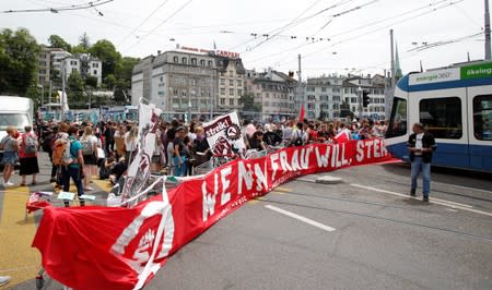 The traffic is blocked by the participants of a women's strike at the Central Square in Zurich