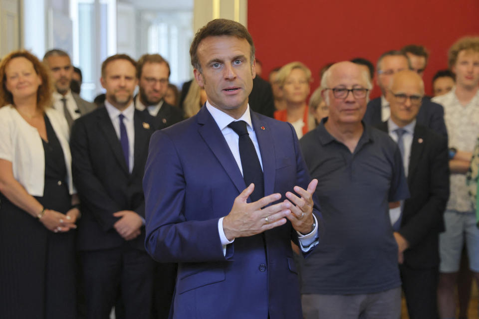 French President Emmanuel Macron delivers a speech as he meets rescue forces in Annecy, French Alps, Friday, June 9, 2023. A man with a knife stabbed four young children at a lakeside park in the French Alps on Thursday June 8, 2023, assaulting at least one in a stroller repeatedly. Authorities said the children, between 22 months and 3 years old, suffered life-threatening injuries, and two adults were also wounded. (Denis Balibouse/Pool via AP)