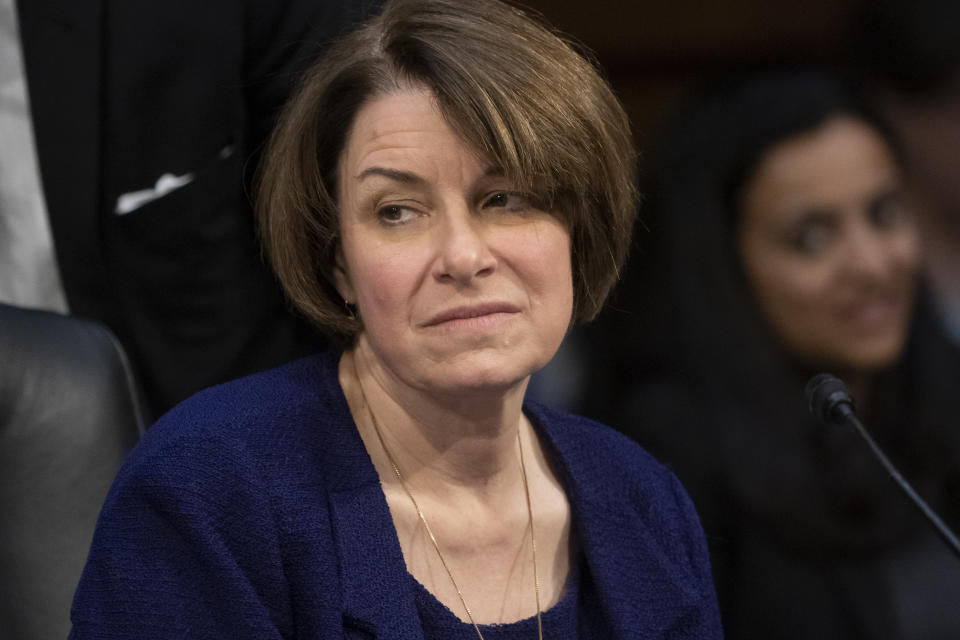 Senate Judiciary Committee member Sen. Amy Klobuchar, D-Minn., prepares to vote against advancing William Barr's nomination for attorney general, as the panel meets on Capitol Hill in Washington, Thursday, Feb. 7, 2019. "This is not the time to install an attorney general who has repeatedly espoused a view of unfettered executive power." Klobuchar said Thursday. (AP Photo/J. Scott Applewhite)