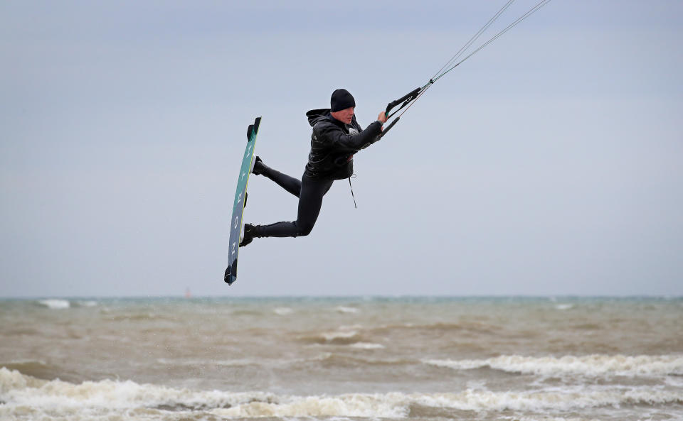 <p>A kitesurfer enjoys the strengthening winds in Camber, East Sussex. Picture date: Thursday May 20, 2021.</p>
