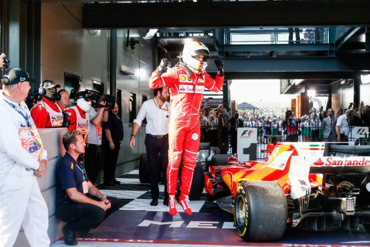 Leap of faith: Sebastian Vettel celebrates a long-awaited Ferrari victory in Melbourne