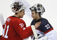 Canada goaltender Carey Price greets USA goaltender Jonathan Quick after the 1-0 Canada win in the men's semifinal ice hockey game at the 2014 Winter Olympics, Friday, Feb. 21, 2014, in Sochi, Russia. (AP Photo/Matt Slocum)