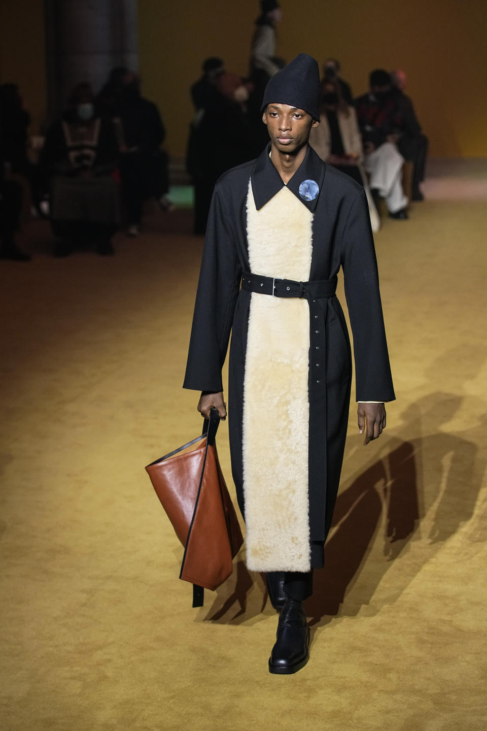 A model wears a creation for the Jil Sander fall-winter 22/23 men's collection, in Paris, Friday, Jan. 21, 2022. (AP Photo/Michel Euler)