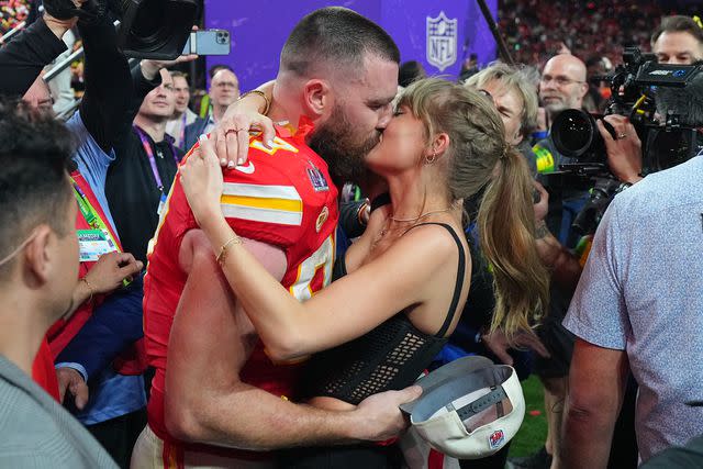 <p>Erick W. Rasco/Sports Illustrated via Getty</p> Travis Kelce and Taylor Swift kiss after his Super Bowl win in February 2024