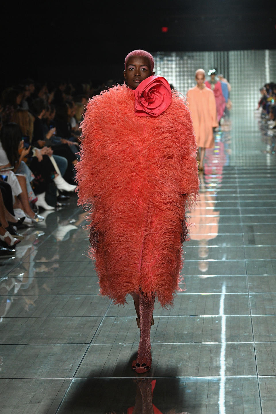 The designer also went bold with this bright feathered coat.&nbsp;