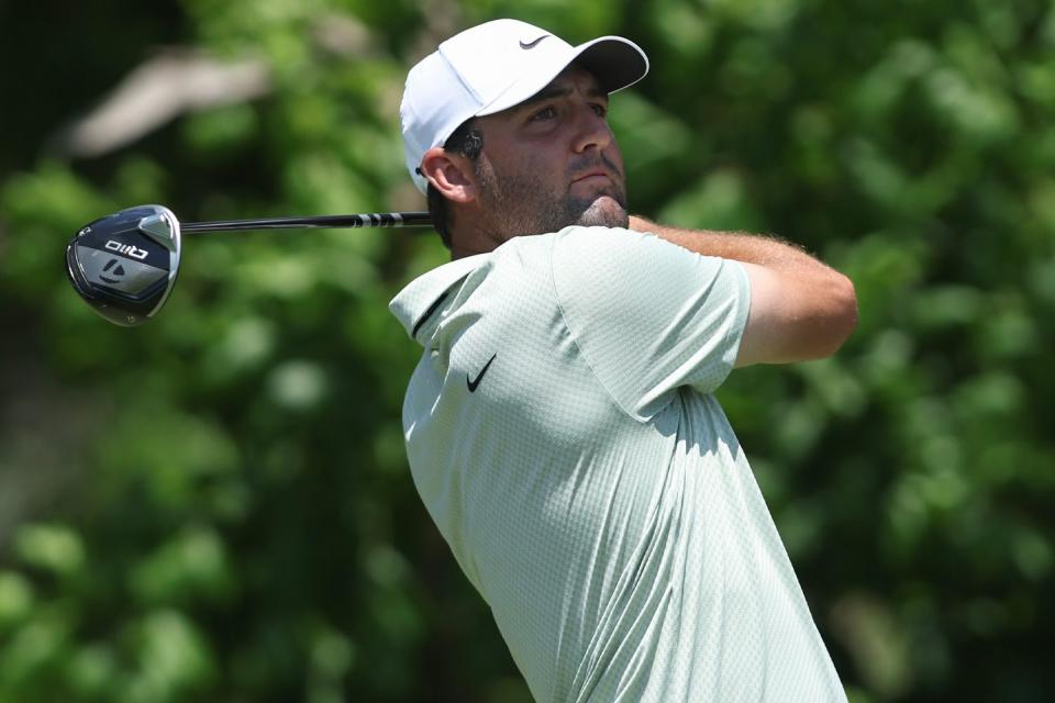 <p>Sam Hodde/Getty</p> Scottie Scheffler hits a tee shot in the final round of the Charles Schwab Challenge on May 26, 2024