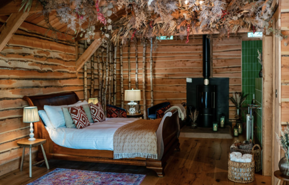 Each stylishly rustic hut comes with its own hot tub and fire pit (Longville House)