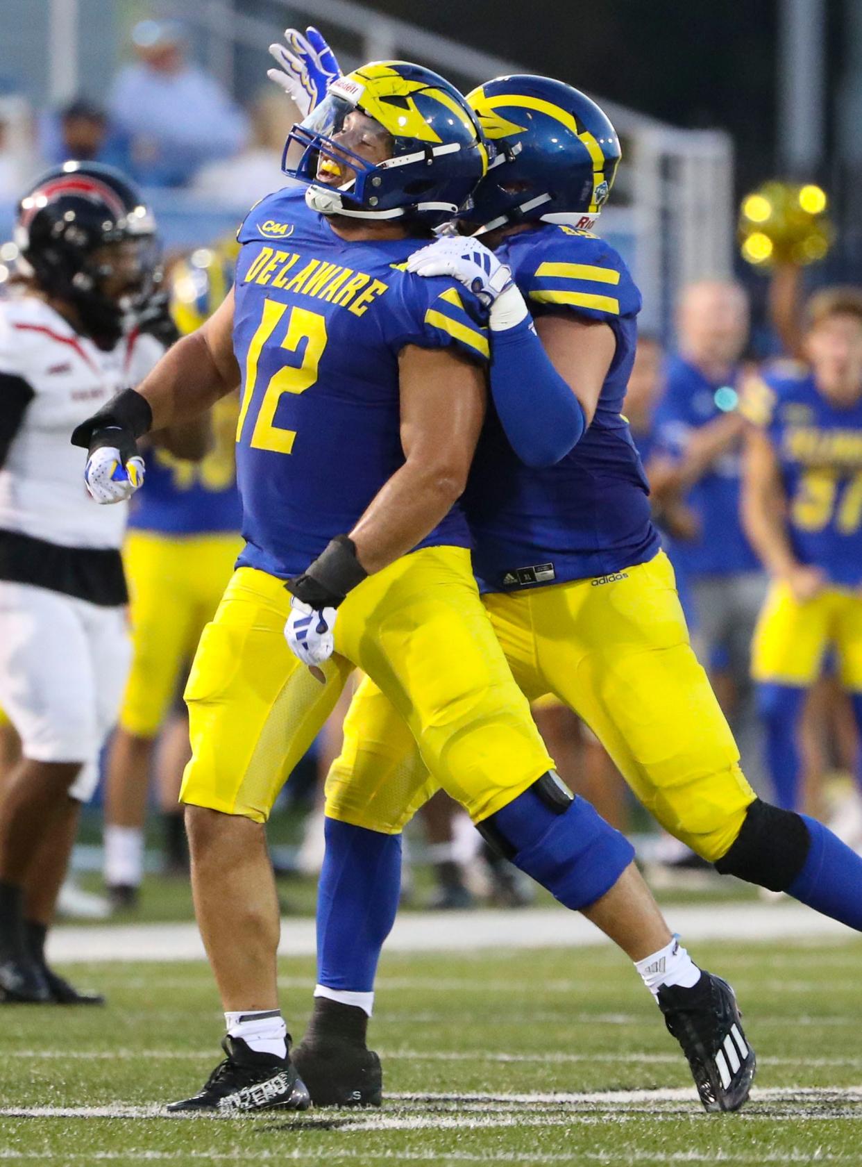 Delaware linebacker Chase McGowan (12) enjoys a sack against Saint Francis late in the first half at Delaware Stadium, Saturday Sept. 16, 2023.