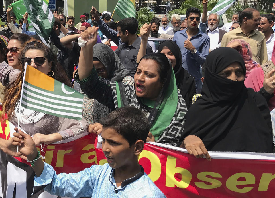 Pakistani Kashmiris observe Black Day on the occasion of India's Independence Day near Indian High Commission in Islamabad, Pakistan, Thursday, Aug. 15, 2019. Pakistan's prime minister has questioned the silence of world community over recent change in the status of Indian-administered sector of Kashmir by New Delhi and lingering imposition of security clampdown which deprived Kashmiri people of their basic rights. (AP Photo/B.K. Bangash)