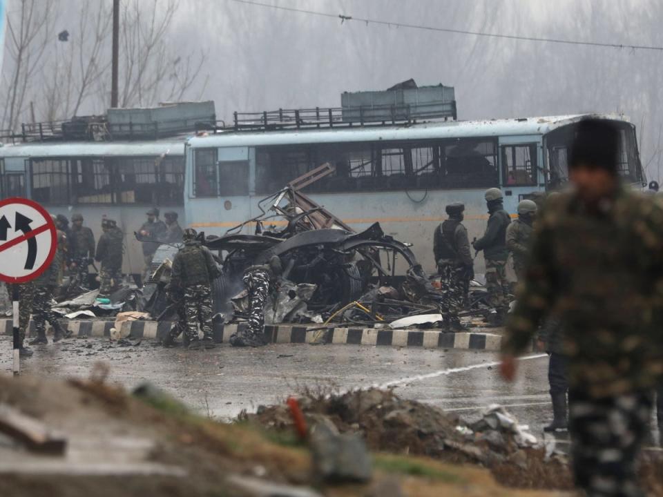 Indian security men inspect the site of the Pulwama attack in 2019 (EPA)