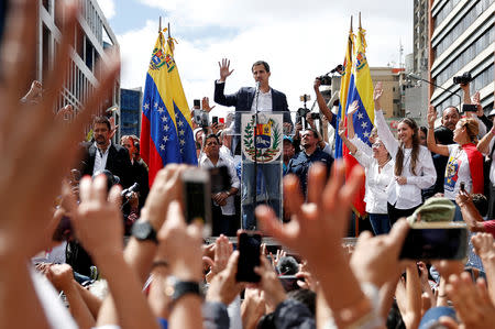 Juan Guaido, President of Venezuela's National Assembly, gestures during a rally against Venezuelan President Nicolas Maduro's government and to commemorate the 61st anniversary of the end of the dictatorship of Marcos Perez Jimenez in Caracas, Venezuela January 23, 2019. REUTERS/Carlos Garcia Rawlins