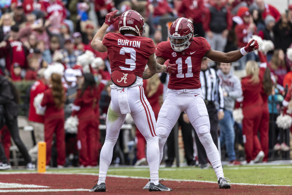 Alabama wide receiver Jermaine Burton (3) celebrates with wide receiver Traeshon Holden (11) after Burton's touchdown during the first half of an NCAA college football game against Austin Peay, Saturday, Nov. 19, 2022, in Tuscaloosa, Ala. (AP Photo/Vasha Hunt)