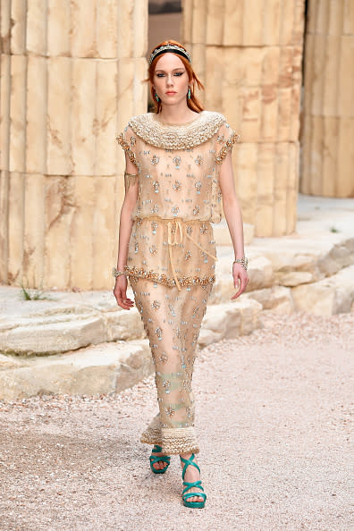 <p>A model in a delicately embroidered dress walks the runway during Chanel Cruise 2018 Collection at Grand Palais in Paris. (Photo: Getty Images) </p>