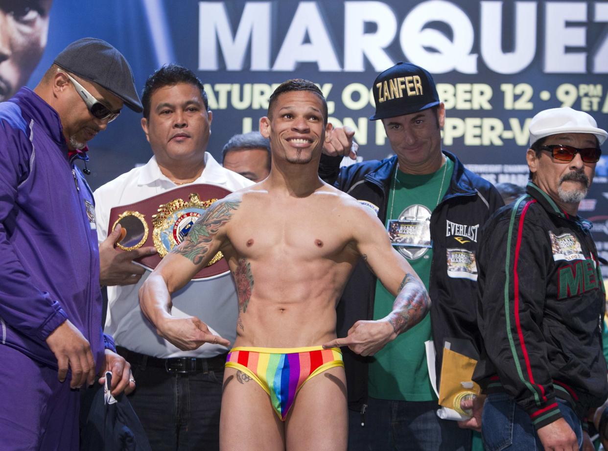 Featherweight boxer Orlando Cruz of Puerto Rico poses during an official weigh-in at the Wynn Las Vegas in Las Vegas, Nevada October 11, 2013. Cruz, boxing's first openly gay fighter, and Orlando Salido of Mexico will fight for a vacant WBO featherweight championship at the Thomas & Mack Center on October 12. REUTERS/Steve Marcus (UNITED STATES - Tags: SPORT BOXING TPX IMAGES OF THE DAY)