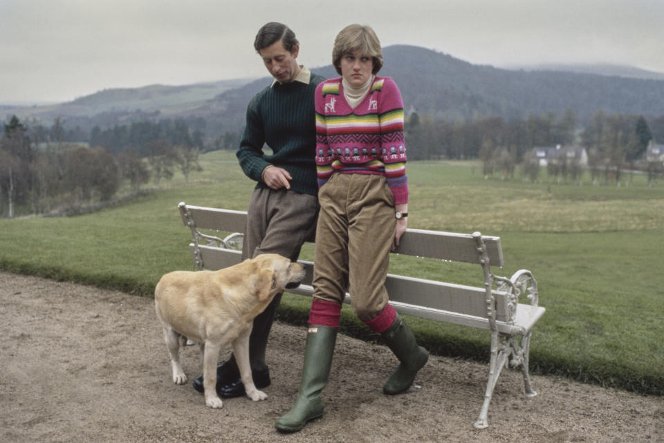 Prince Charles and Lady Diana Spencer (later Diana, Princess of Wales, 1961 - 1997) hold a photocall with their dog Harvey at Craigowan Lodge in Balmoral, Scotland, 6th May 1981. This was their first official photocall after their engagement. Diana is wearing an Inca jumper with green corduroy trousers and Hunter boots. (Photo by Tim Graham/Getty Images)