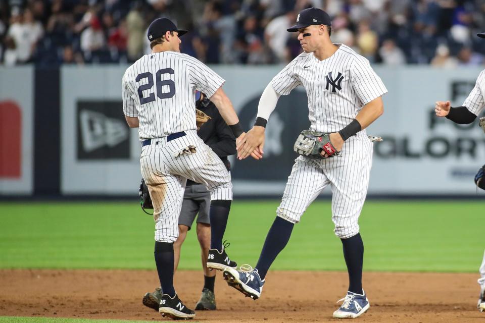 DJ LeMahieu and Aaron Judge celebrate a win against the Angels.