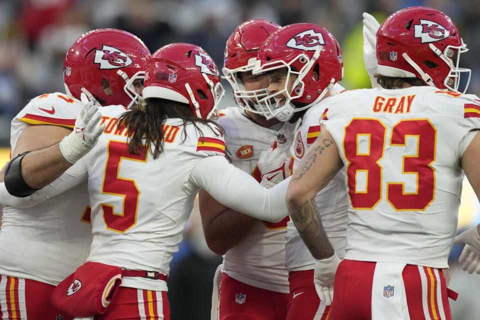 Kansas City Chiefs place kicker Harrison Butker, center right, celebrates with teammates after kicking a field goal during the second half of an NFL football game against the Los Angeles Chargers, Sunday, Jan. 7, 2024, in Inglewood, Calif. (AP Photo/Ashley Landis)