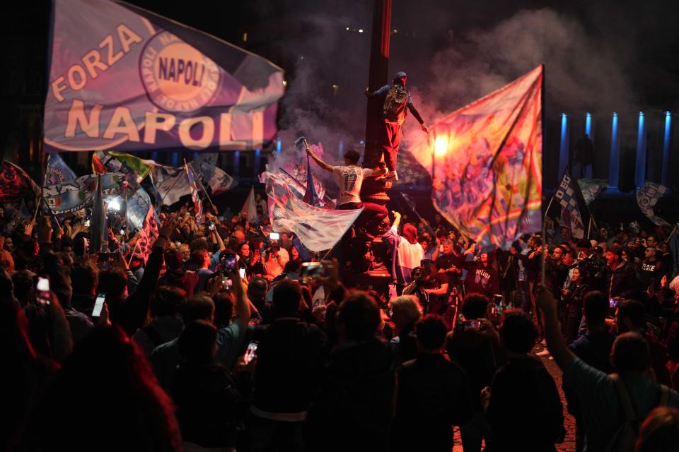 Napoli fans celebrates after winning the Italian league soccer title, in Naples, Italy, Thursday, May 4, 2023. (AP Photo/Andrew Medichini)