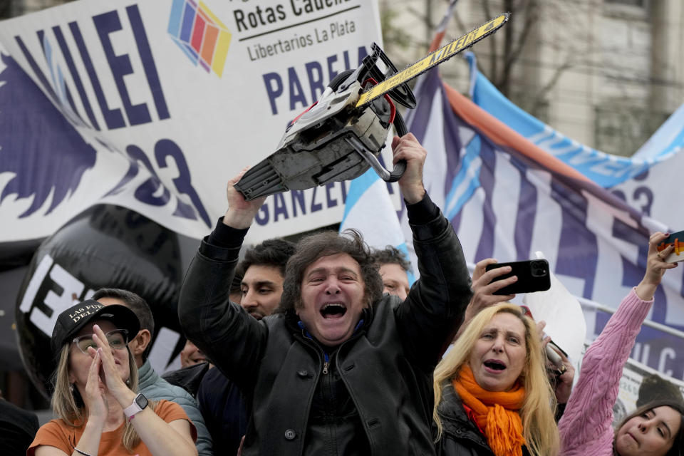 FILE - Presidential hopeful of the Liberty Advances coalition Javier Milei brandishes a chainsaw during a rally in La Plata, Argentina, Tuesday, Sept. 12, 2023. During campaign stops and interviews Milei has hurled abuse against Argentina´s political class, leftist Latin American presidents such as Mexico´s Andres Lopez Obrador, journalists and Pope Francis, and leads the polls in the South American country´s upcoming elections. (AP Photo/Natacha Pisarenko, File)