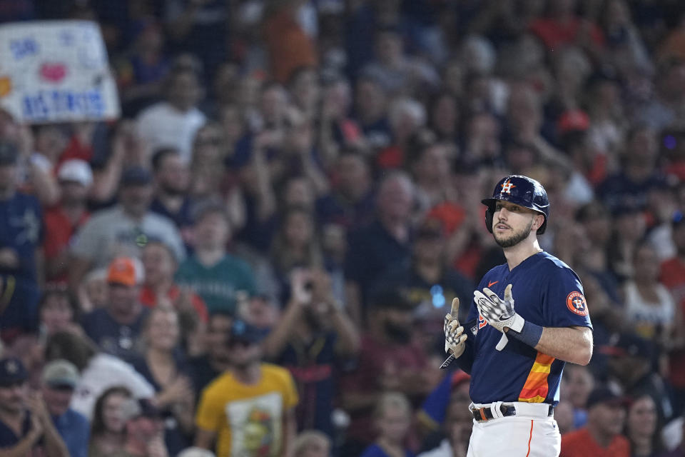 Houston Astros' Kyle Tucker stands at third base after hitting an RBI double against the Seattle Mariners and advancing on a throwing error during the first inning of a baseball game Saturday, July 8, 2023, in Houston. (AP Photo/Kevin M. Cox)