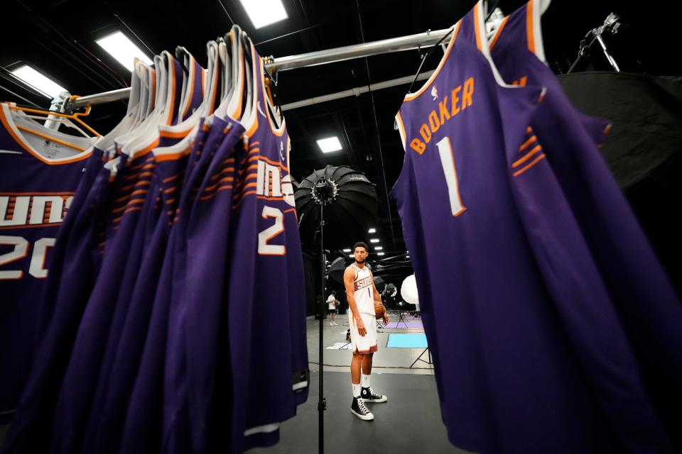 Phoenix Suns guard Devin Booker (1) poses for a portrait during media day at Footprint Center.