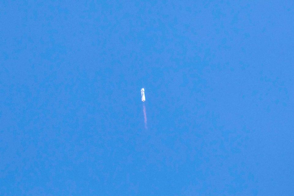 A rocket high in the west Texas sky launches towards space.