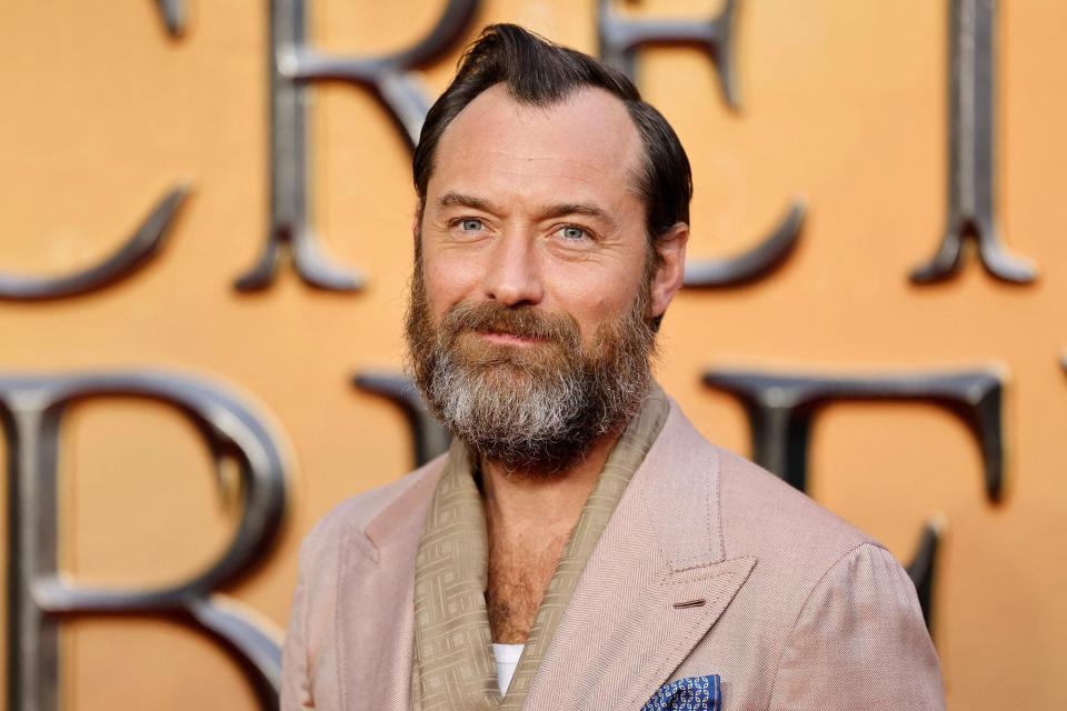 British actor Jude Law poses on the red carpet after arriving to attend the World Premiere of the film "Fantastic Beasts: The Secrets of Dumbledore" in London on March 29, 2022.