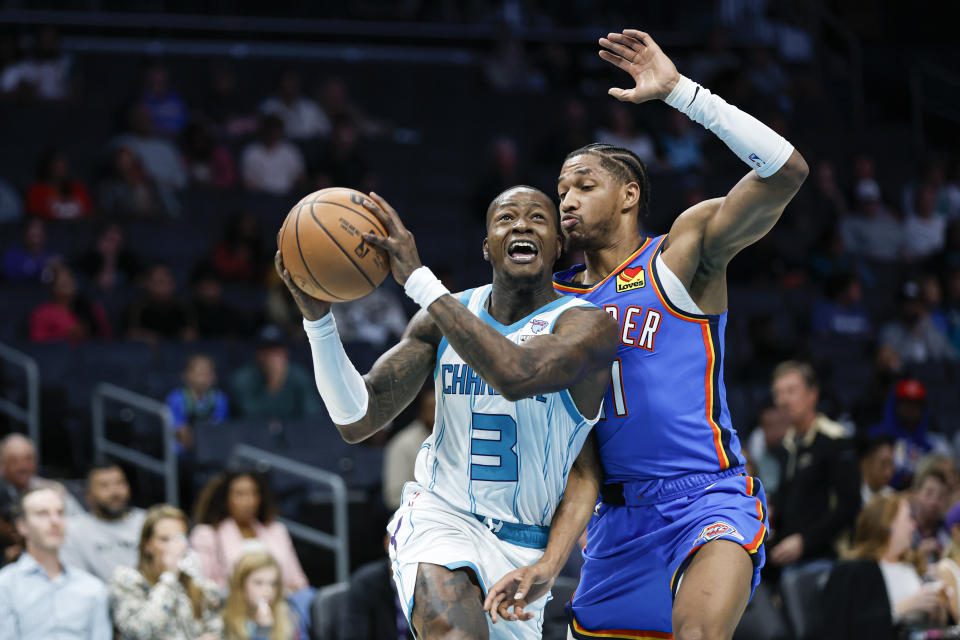 Oct 15, 2023; Charlotte, North Carolina, USA; Charlotte Hornets guard Terry Rozier (3) drives to the basket against Oklahoma City Thunder guard Aaron Wiggins (21) in the second half at Spectrum Center. Mandatory Credit: Nell Redmond-USA TODAY Sports