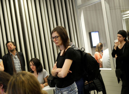 Students and faculty of the Hungary-based Central European University listen to the school's rector, Michael Ignatieff, address a town hall meeting after the government of Prime Minister Viktor Orban tabled a new bill that could force the 25-year-old school out of Hungary, in Budapest, Hungary March 29, 2017. REUTERS/Bernadett Szabo