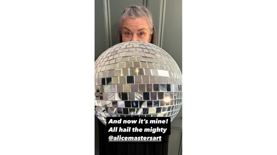 Dawn holding a discoball 