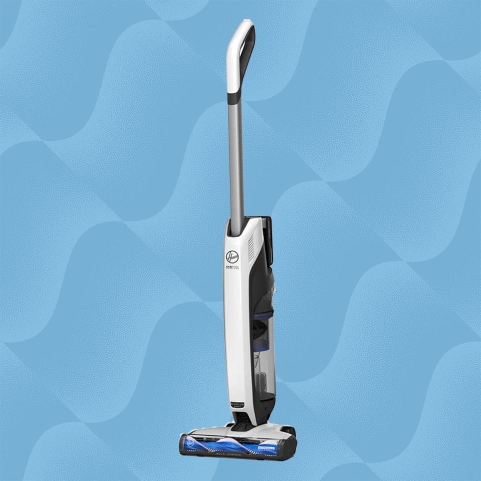 the hoover onepwr evolve vacuum against a wave blue background