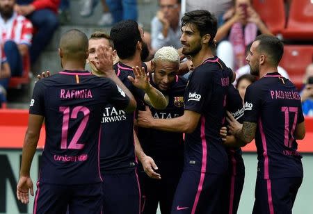 Football Soccer - Sporting Gijon v Barcelona - Spanish La Liga Santander - El Molinon stadium, Gijon, Spain- 24/09/16. Barcelona's Neymar (C) celebrates his goal with teammates. REUTERS/Eloy Alonso